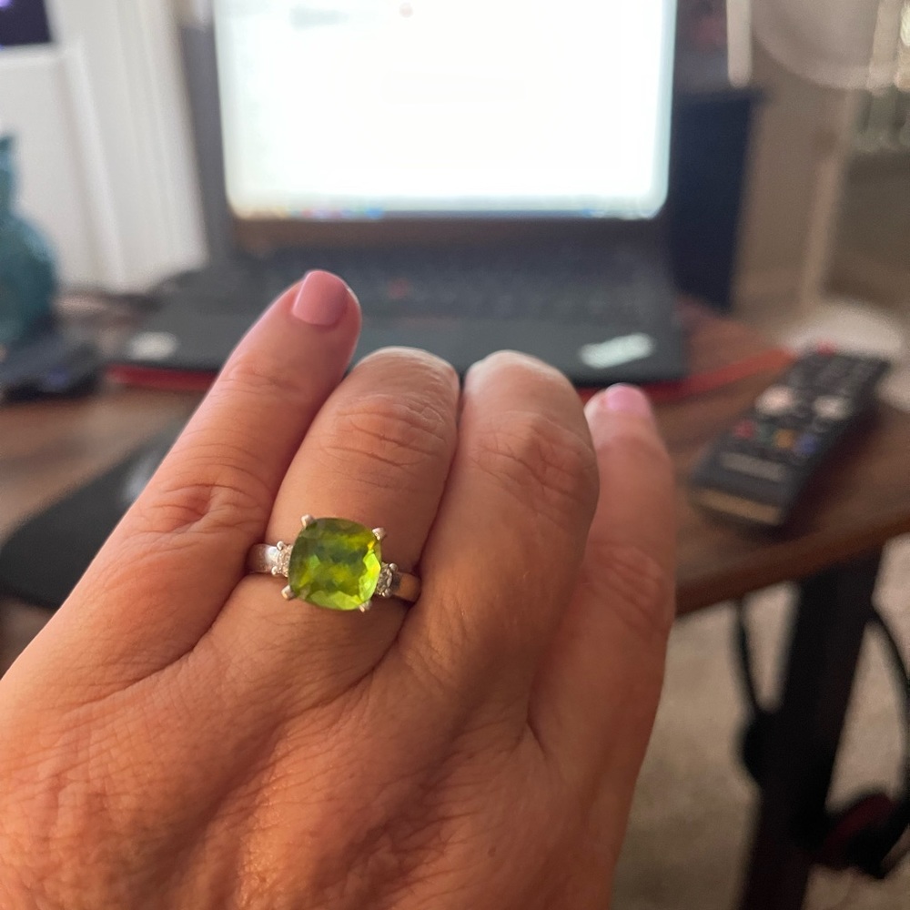 Selling over 5 ct Peridot engagement ring with side diamonds